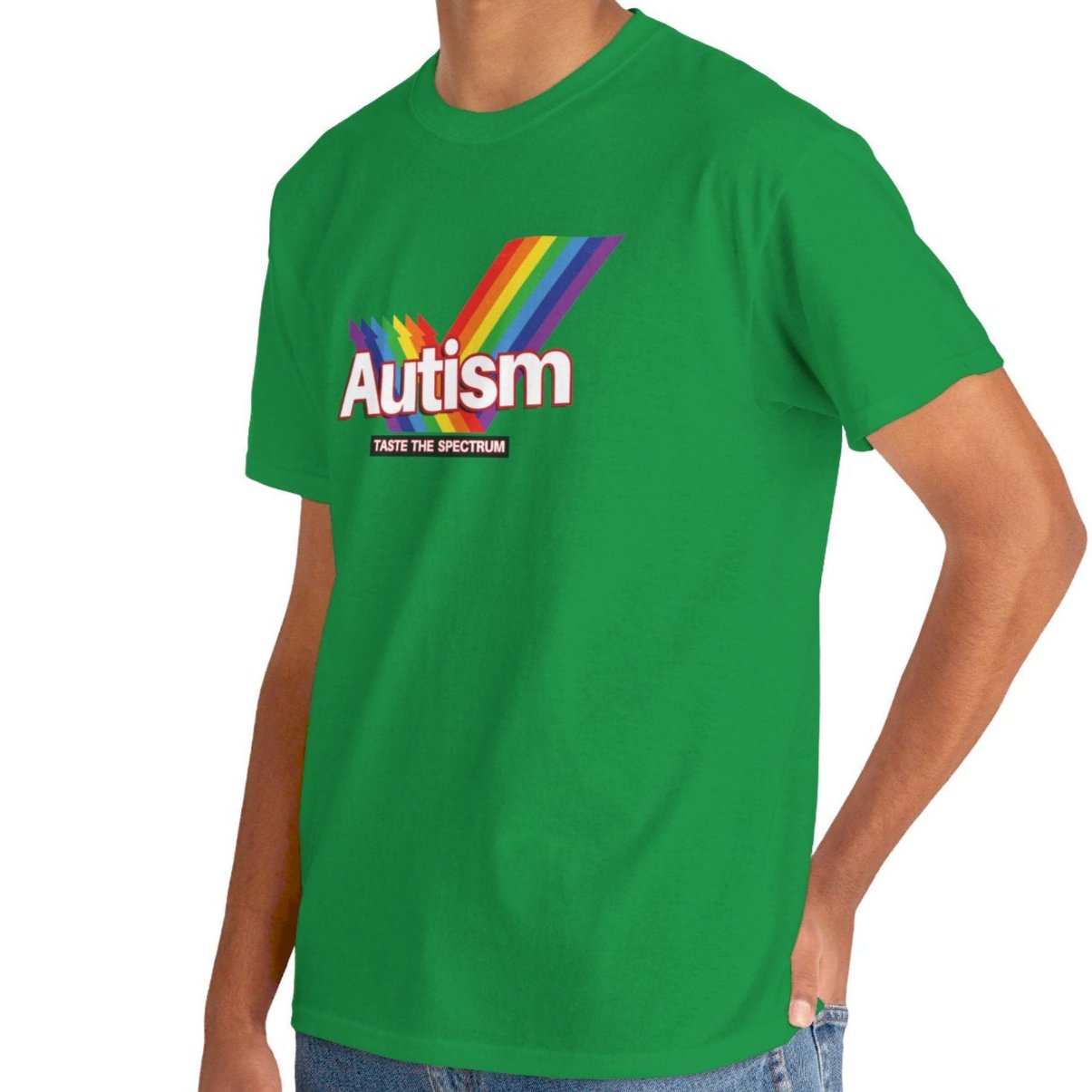 Side view of a green T-shirt worn by a person, featuring the phrase "Autism" in a Skittles-inspired design and a rainbow graphic. Part of the Vivid Divergence Sensory Friendly Unisex Tees Range.