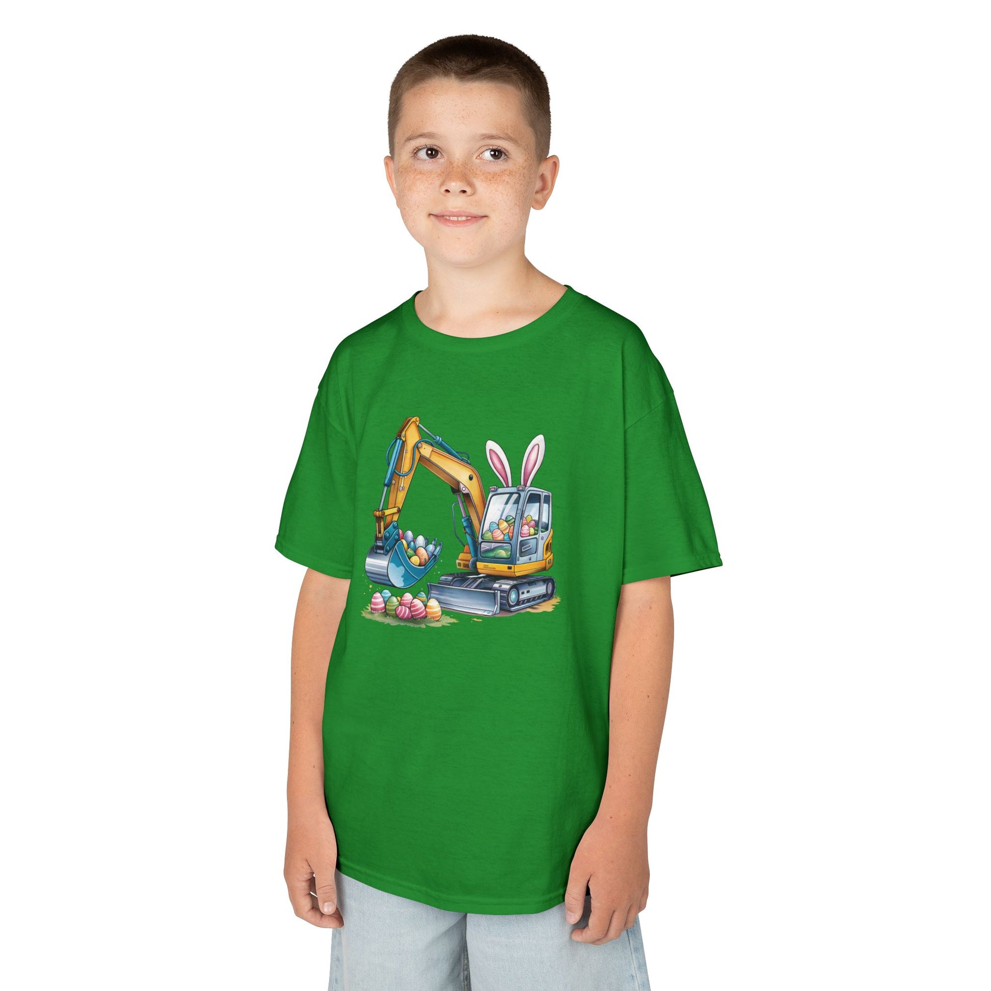 Child wearing a green Easter T-shirt with an excavator digging up festive eggs, a playful construction-themed holiday outfit. Hop into the season in style and shop Easter shirts online today!