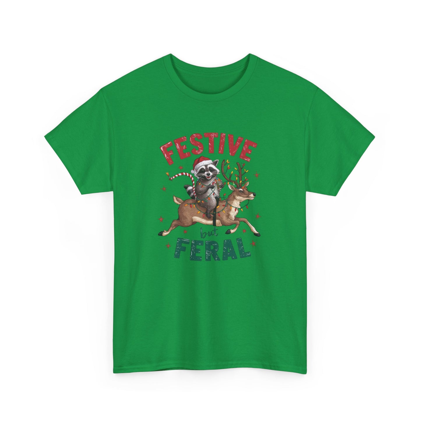 Front view of a green T-shirt featuring a festive illustration of a raccoon (trash panda) holding Christmas lights and the text "Festive but Feral." Part of the Vivid Divergence Sensory Friendly Unisex Tees Range.