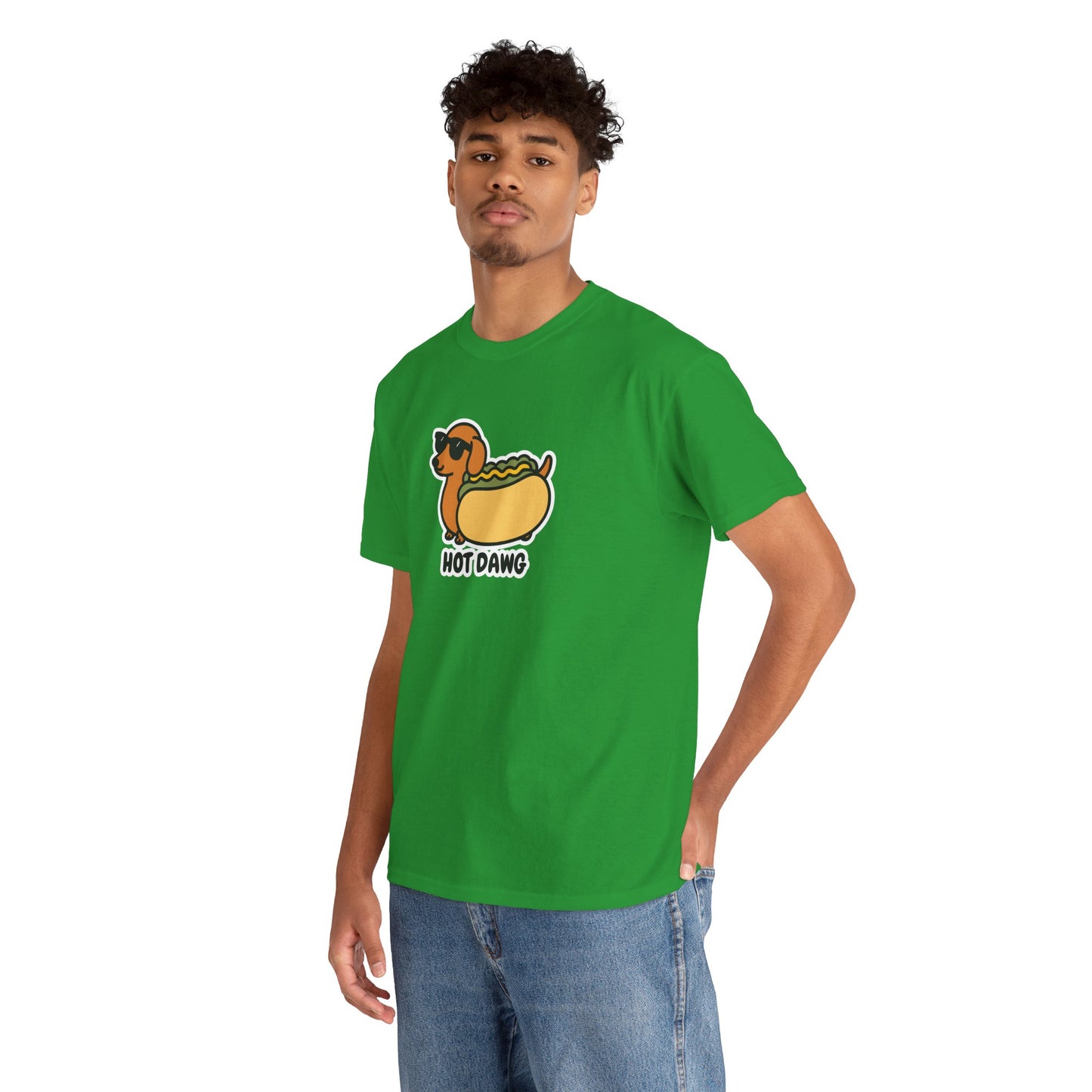 Model wearing a green T-shirt featuring a "Hot Dawg" design with a cartoon dachshund inside a hot dog bun wearing sunglasses. Part of the Vivid Divergence Sensory Friendly Unisex Tees Range.