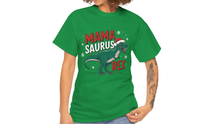 Model wearing a green T-shirt featuring a "Mama-Saurus Rex" design with a festive dinosaur illustration, styled casually with a denim jacket. Part of the Vivid Divergence Sensory Friendly Unisex Tees Range.
