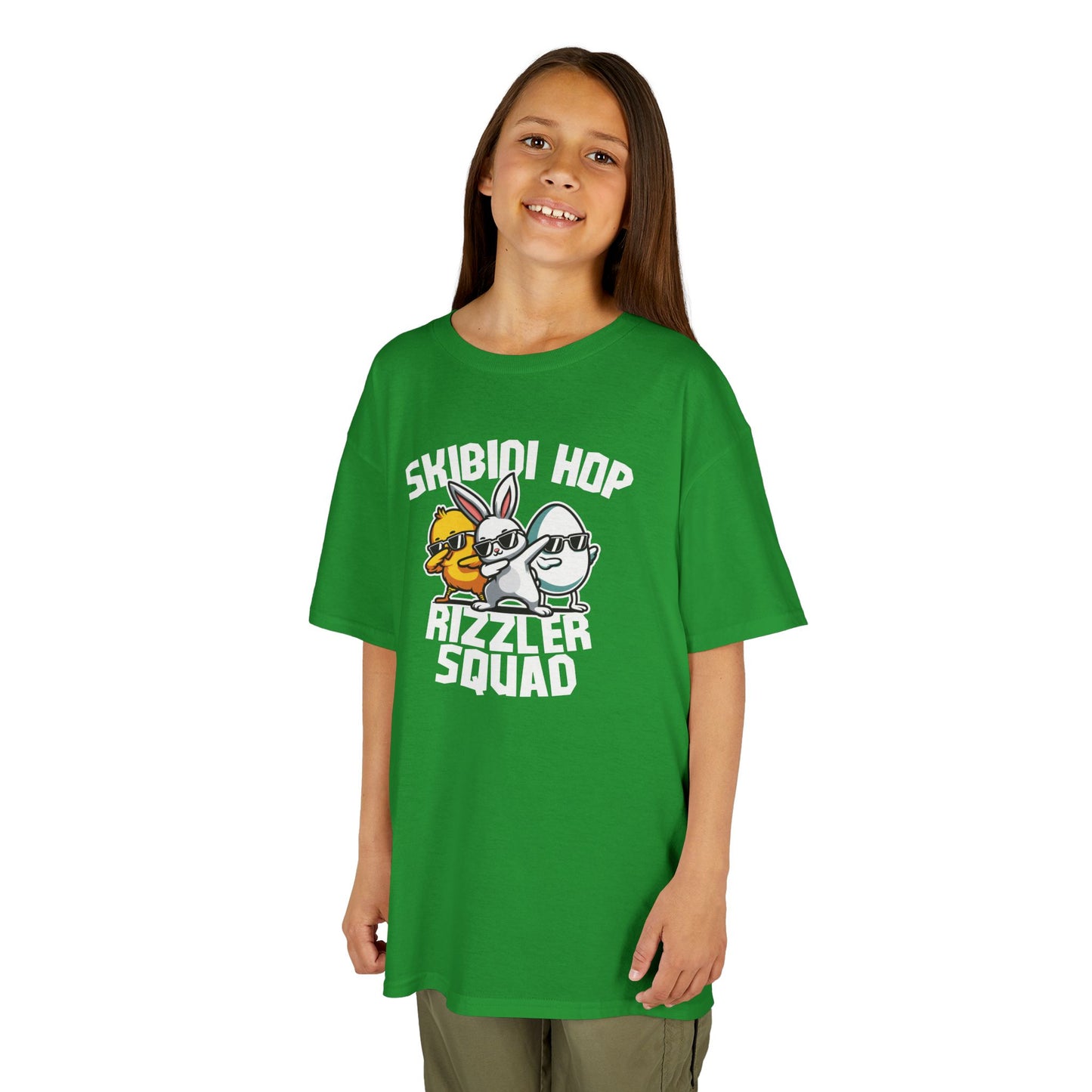 Child wearing a green Easter T-shirt with "Skibidi Hop Rizzler Squad" text, a playful and trendy Easter meme look. Hop into the season in style and shop Easter shirts online today!