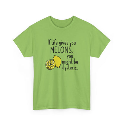 Front view of a green T-shirt featuring a lemon and melon graphic with the text "If life gives you melons, you might be dyslexic." Part of the Vivid Divergence Sensory Friendly Unisex Tees Range.