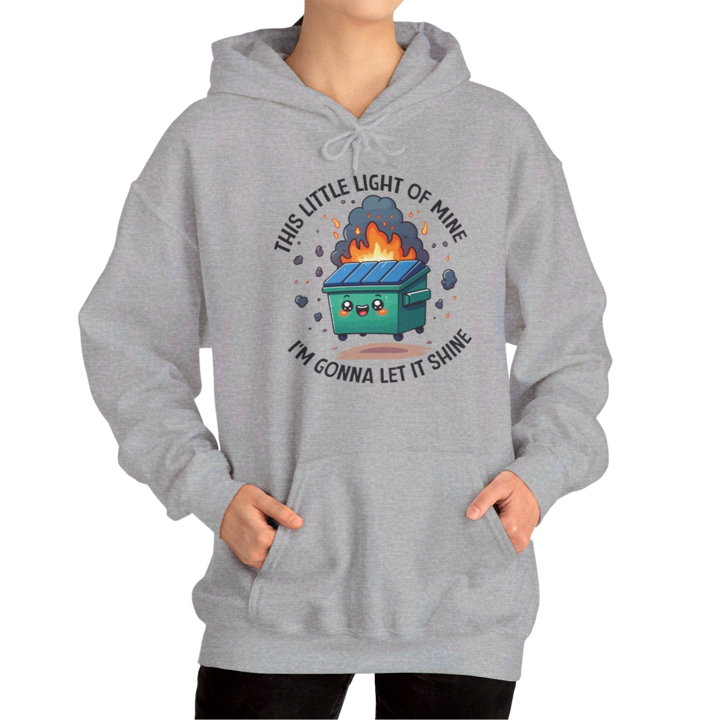 Model wearing a grey hoodie featuring the text "This Little Light of Mine, I'm Gonna Let It Shine" and a cartoon illustration of a dumpster fire with glowing flames. Part of the Vivid Divergence Sensory Friendly Unisex Hoodie Range.