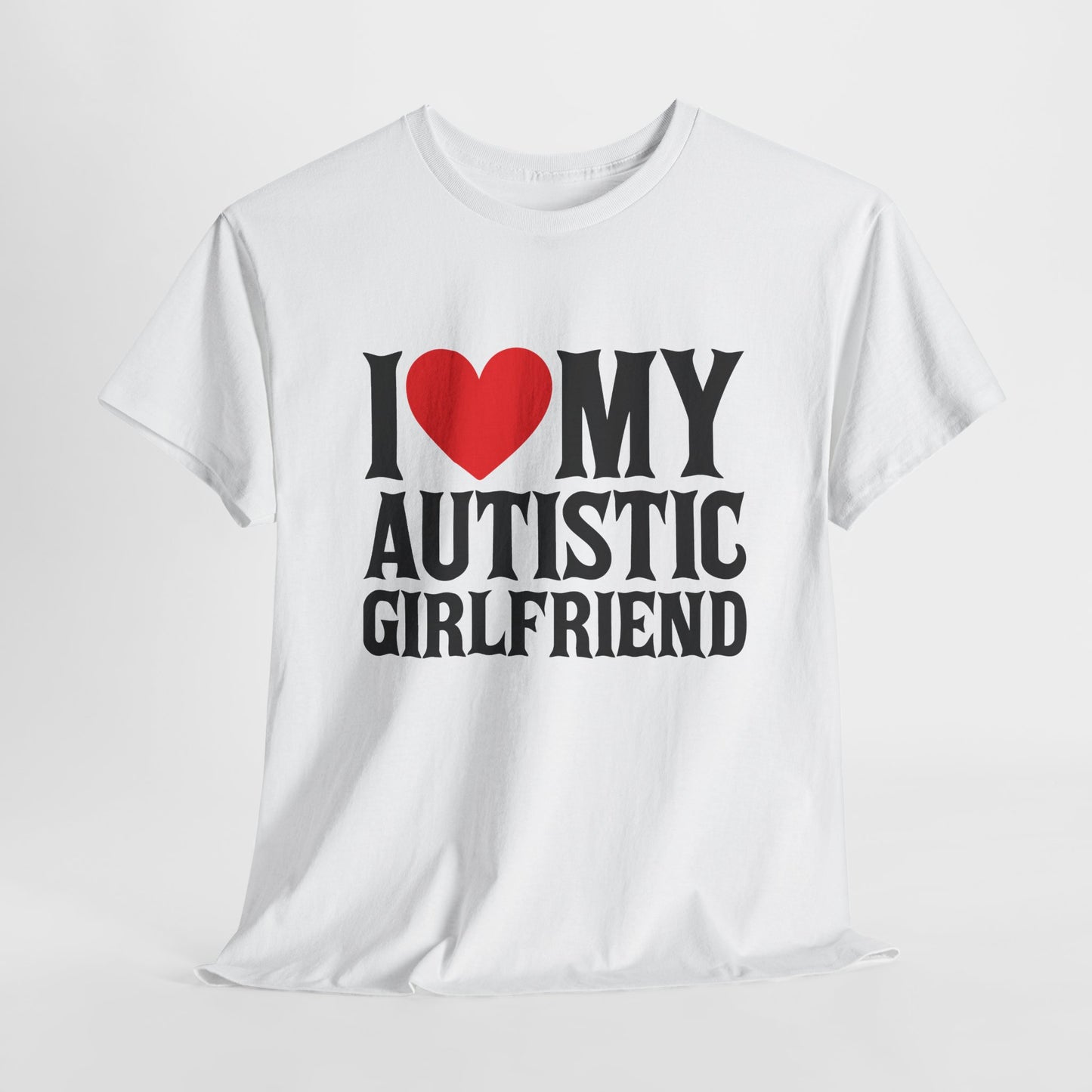 Flat-lay of a white "I ❤️ MY AUTISTIC GIRLFRIEND" T-shirt on a plain background. Part of the Vivid Divergence Sensory Friendly Unisex Tees Range.