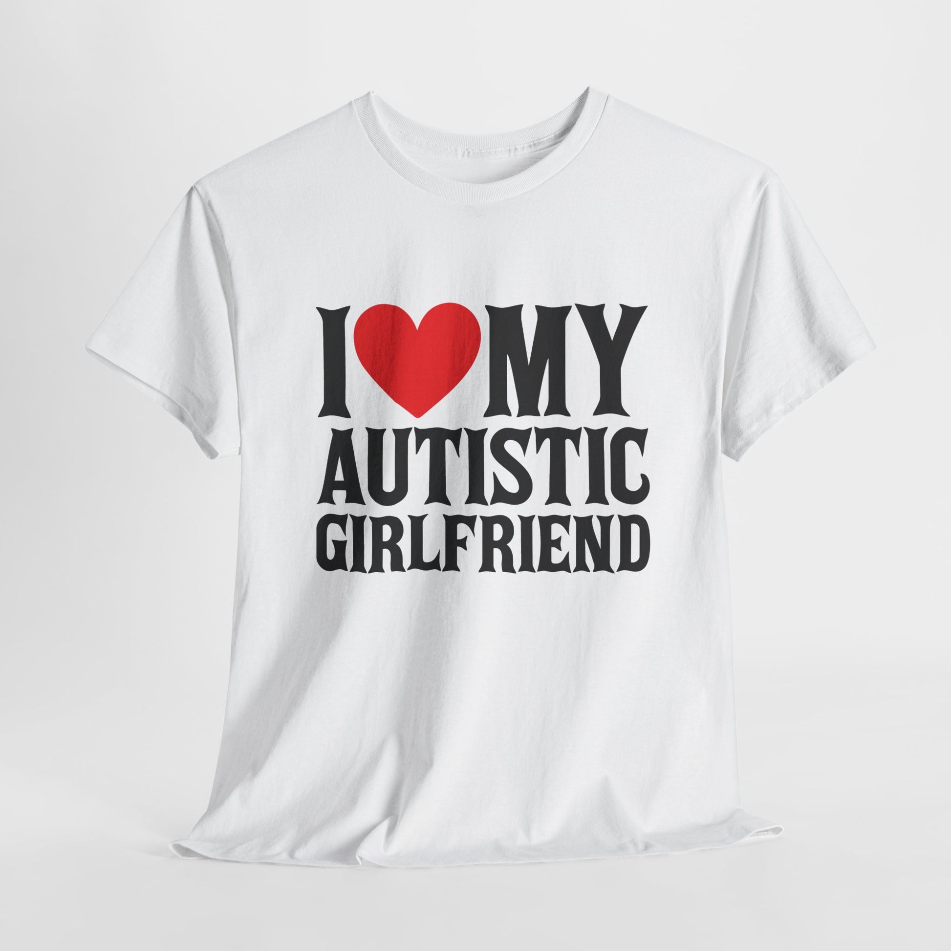 Flat-lay of a white "I ❤️ MY AUTISTIC GIRLFRIEND" T-shirt on a plain background. Part of the Vivid Divergence Sensory Friendly Unisex Tees Range.