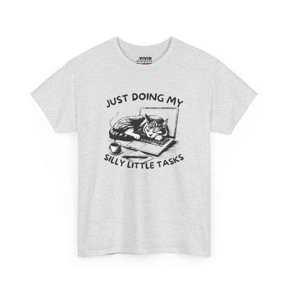 Front view of ash gray T-shirt with cat-on-laptop design and the phrase “Just Doing My Silly Little Tasks.” Mentally curled up in the same position. Part of the Vivid Divergence Memewear Collection!
