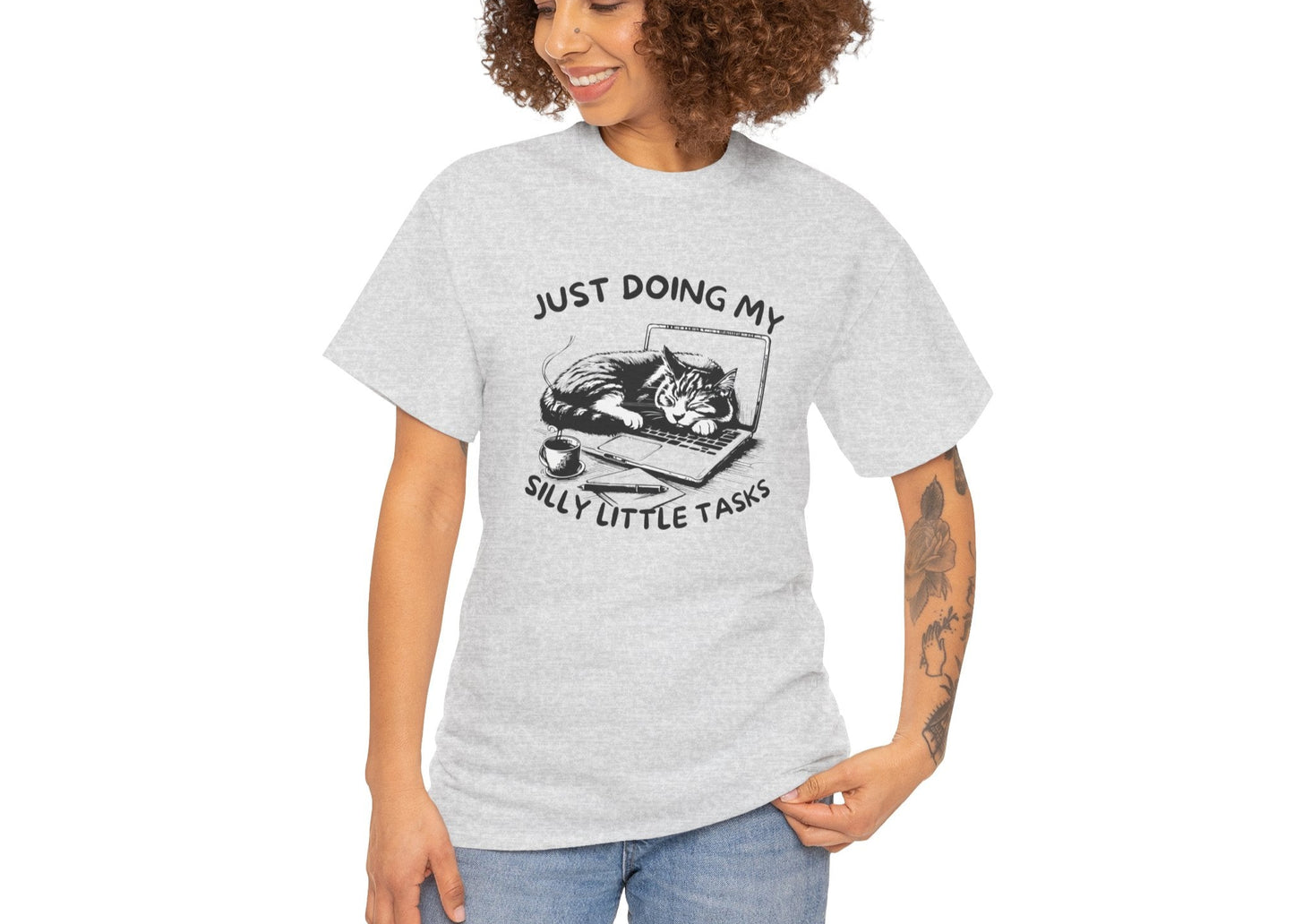 Woman in light grey tee smiling while wearing the meme frog shirt. She’s got three tasks done and that’s a win. Part of the Vivid Divergence Memewear Collection!
