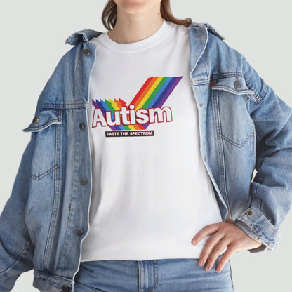Lifestyle view of a person wearing a white T-shirt with the phrase "Autism" in a Skittles-inspired design and rainbow graphic, paired with a denim jacket. Part of the Vivid Divergence Sensory Friendly Unisex Tees Range.