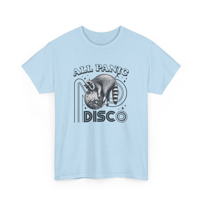 Front view of a light blue T-shirt featuring "All Panic No Disco" text with a raccoon illustration inside a disco ball. Part of the Vivid Divergence Sensory Friendly Unisex Tees Range.
