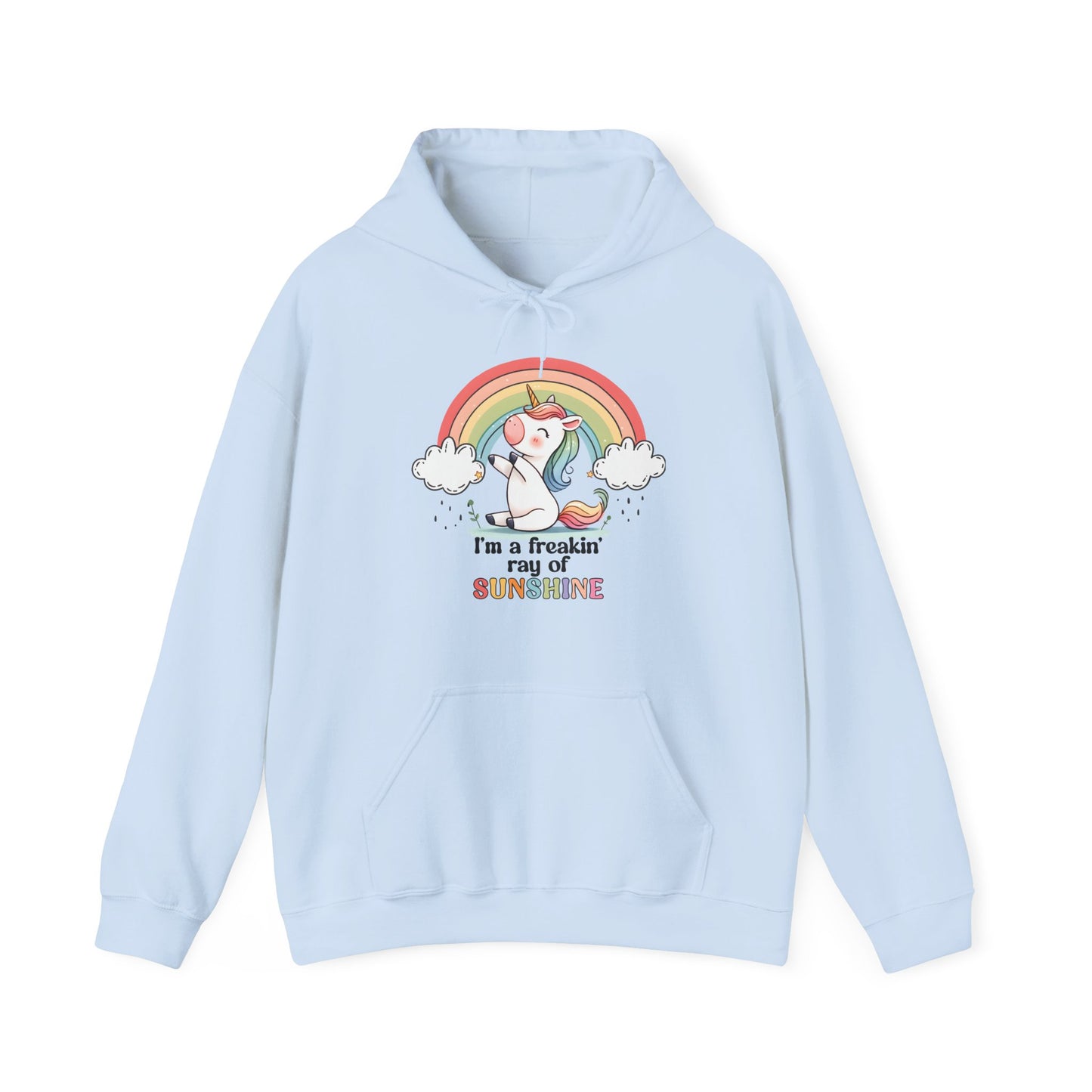 Front view of a light blue hoodie featuring a grumpy-looking unicorn with wings under a rainbow, with the text "I'm a Freakin' Ray of Sunshine." Part of the Vivid Divergence Sensory Friendly Unisex Hoodie Range.