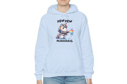 Model wearing a light blue hoodie featuring the text "Pew Pew Madafakas" and a cartoon illustration of a unicorn holding a rainbow water gun. Part of the Vivid Divergence Sensory Friendly Unisex Hoodie Range.