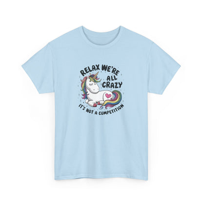 Front view of a light blue T-shirt with "Relax, We're All Crazy" and a whimsical cat graphic in black text. Part of the Vivid Divergence Sensory Friendly Unisex Tees Range.