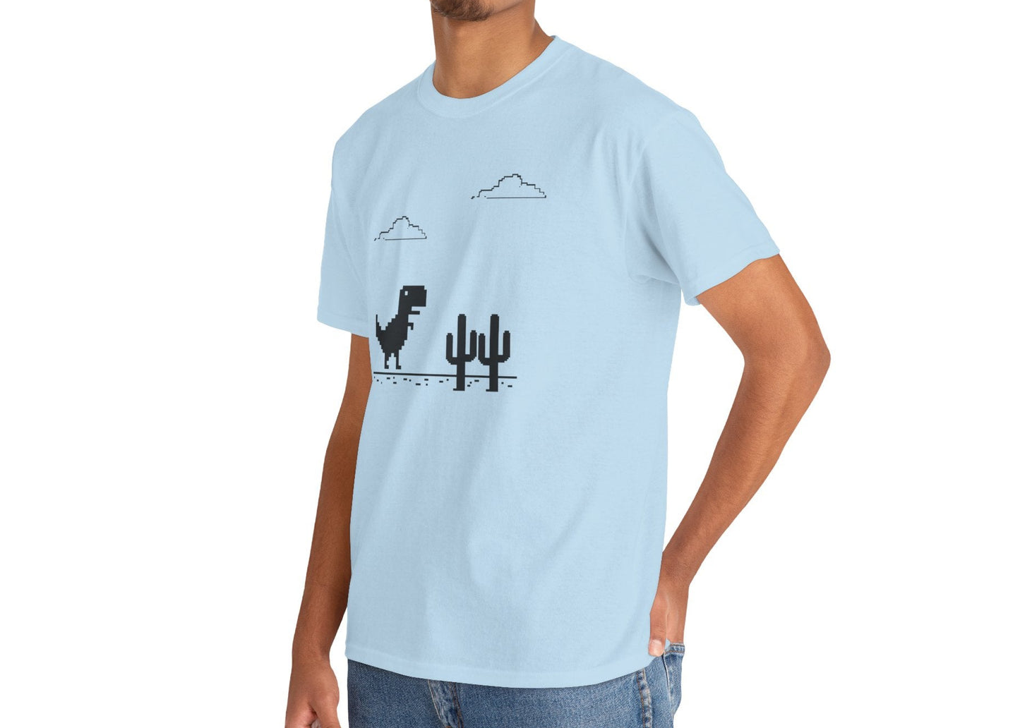 Front view of a light blue T-shirt featuring a minimalist pixel-style T-Rex Runner Dinosaur Game design with a T-Rex, cacti, and clouds. Part of the Vivid Divergence Sensory Friendly Unisex Tees Range.