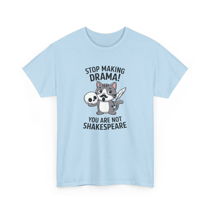 Hanging front view of a light blue T-shirt featuring a cute cat holding a skull and text that reads "Stop Making Drama! You Are Not Shakespeare." Part of the Vivid Divergence Sensory Friendly Unisex Tees Range.