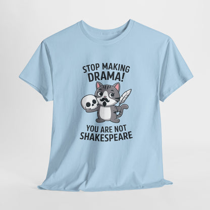 Hanging front view of a light blue T-shirt featuring a cute cat holding a skull and text that reads "Stop Making Drama! You Are Not Shakespeare." Part of the Vivid Divergence Sensory Friendly Unisex Tees Range.