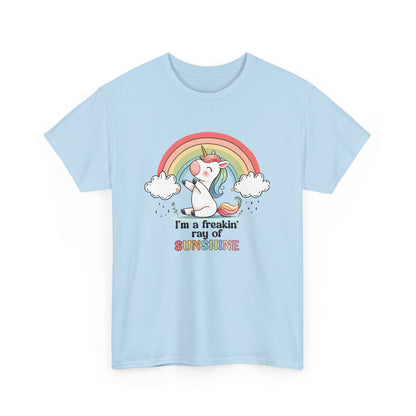 Front view of a light blue T-shirt featuring a rainbow and unicorn graphic with the text "I'm A Freakin Ray Of Sunshine." Part of the Vivid Divergence Sensory Friendly Unisex Tees Range.