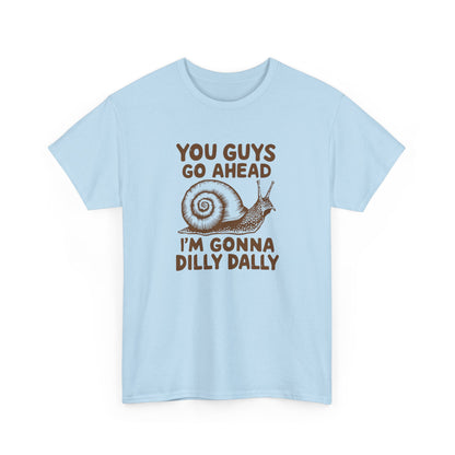 Front view of a light blue T-shirt with the text "You Guys Go Ahead, I'm Gonna Dilly Dally" and a playful snail graphic in brown. Part of the Vivid Divergence Sensory Friendly Unisex Tees Range.