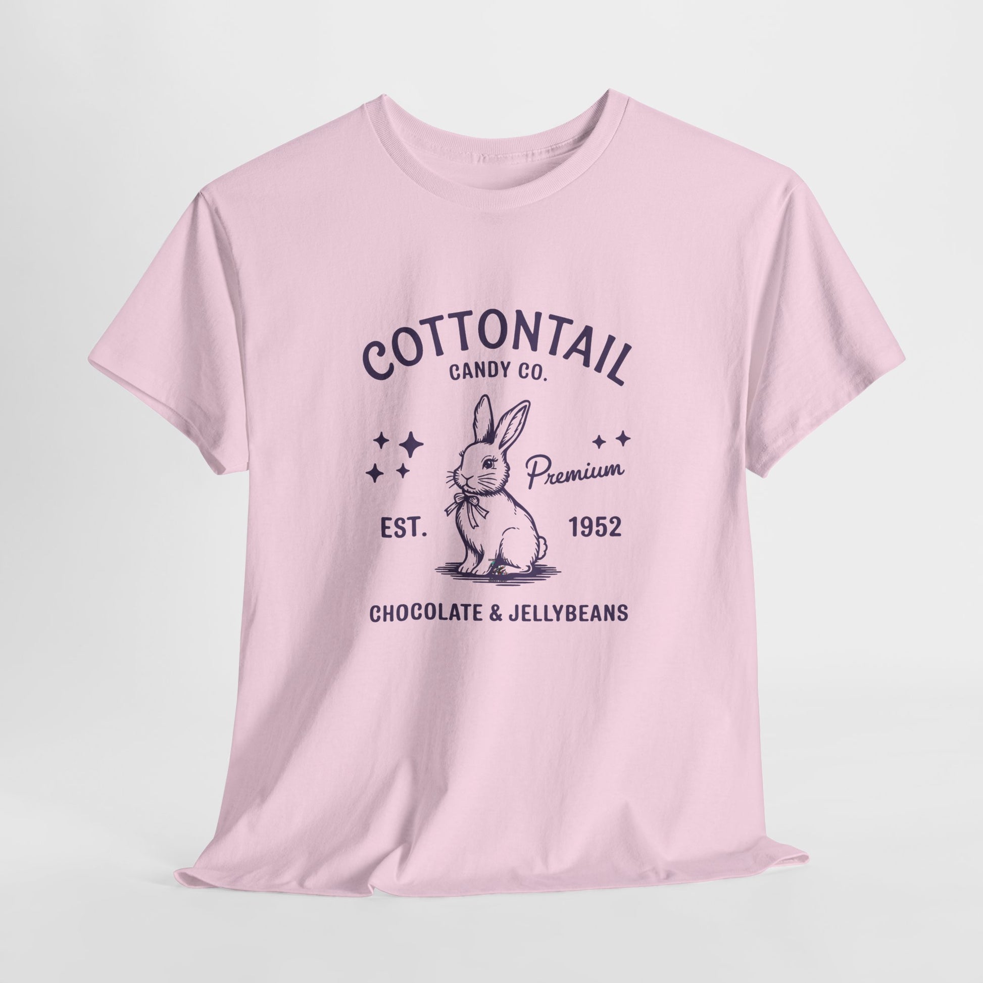 Light Pink T-shirt hanging, featuring a vintage-style "Cottontail Candy Co." bunny design, a soft and elegant Easter outfit. Hop into the season in style and shop Easter shirts online today!