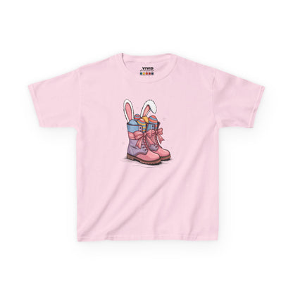 Light Pink kids' T-shirt featuring festive cowgirl boots filled with Easter eggs and bunny ears. A cute and fun Easter outfit. Hop into the season in style and shop Easter shirts online today!