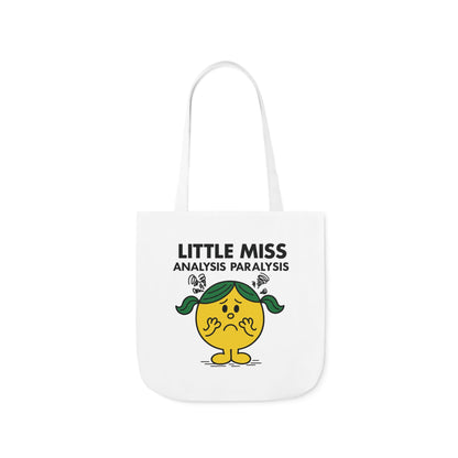 Front view of white canvas tote bag featuring yellow character with green pigtails, hands on cheeks, and spirals of indecision above her head. Text reads "Little Miss Analysis Paralysis." Part of the Vivid Divergence Little Miss Meme Collection!