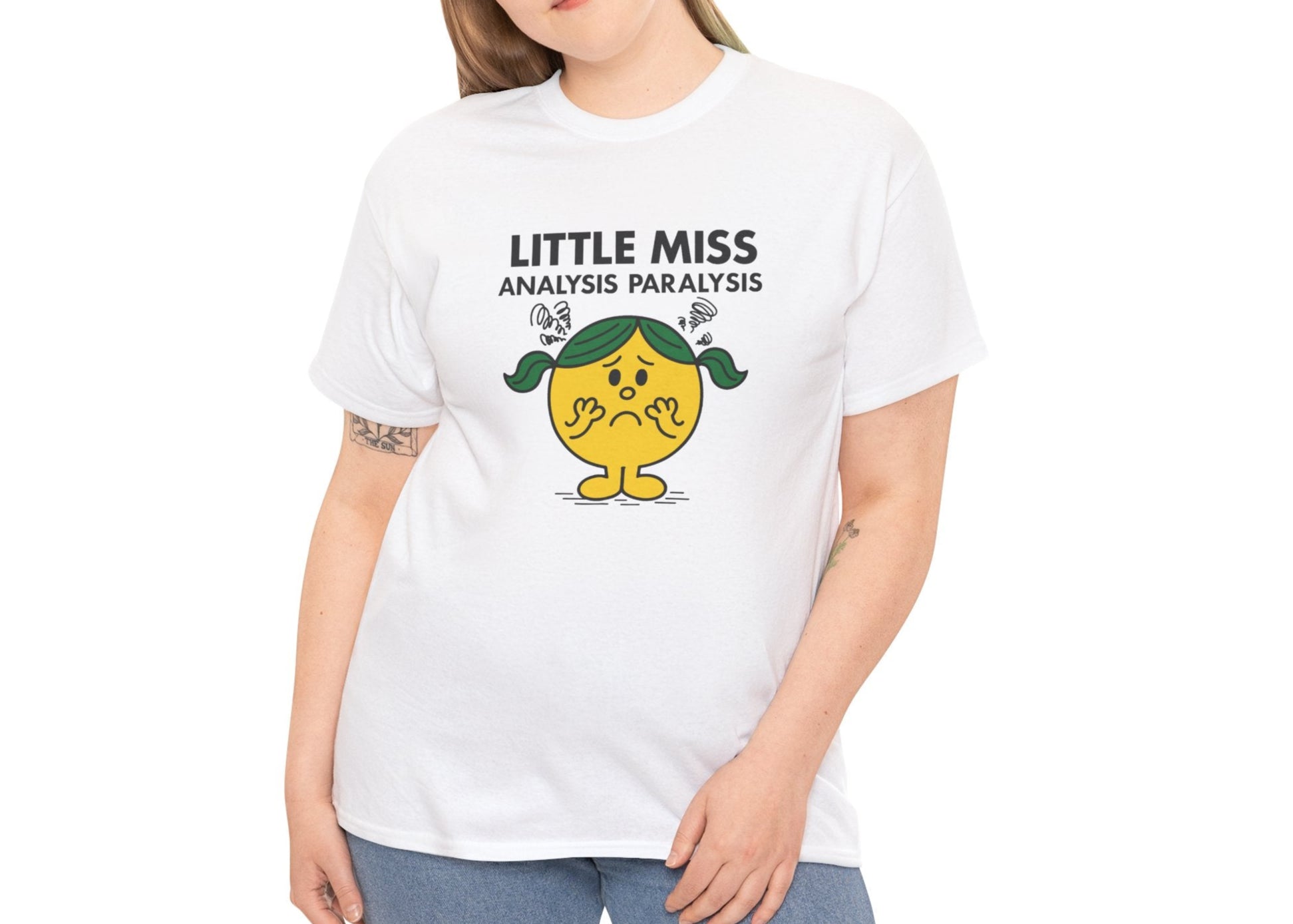 Person wearing the Little Miss Analysis Paralysis T-shirt styled with jeans. Part of the Little Miss Meme Character Collection. A Vivid Divergence Sensory Friendly Unisex Tee.
