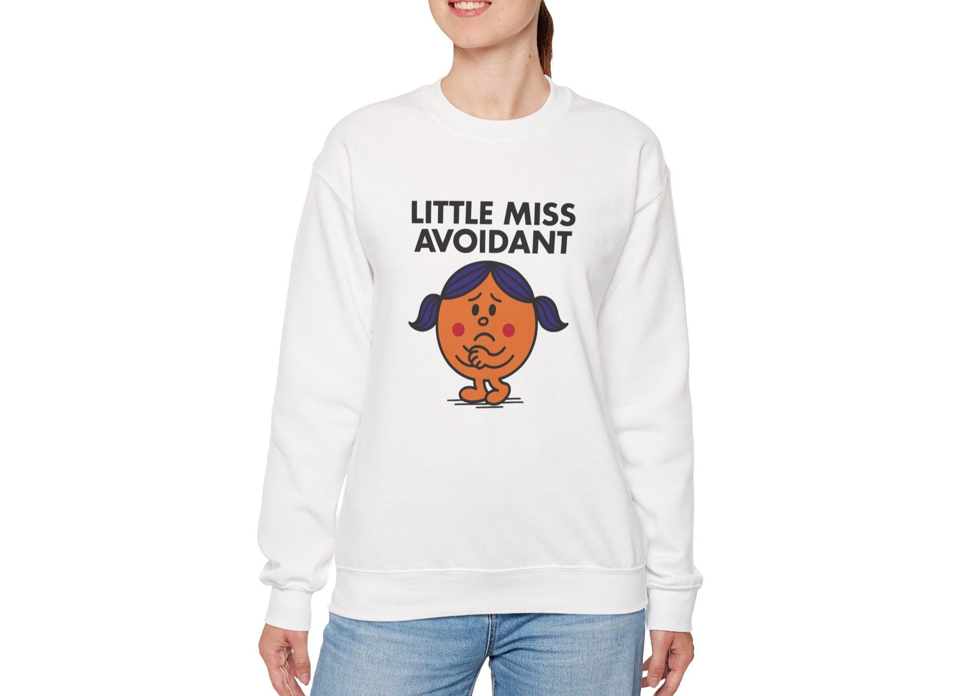 Person wearing the Little Miss Avoidant sweatshirt with blue jeans. Part of the Little Miss Meme Character Collection. A Vivid Divergence Sensory Friendly Sweater Jumper.
