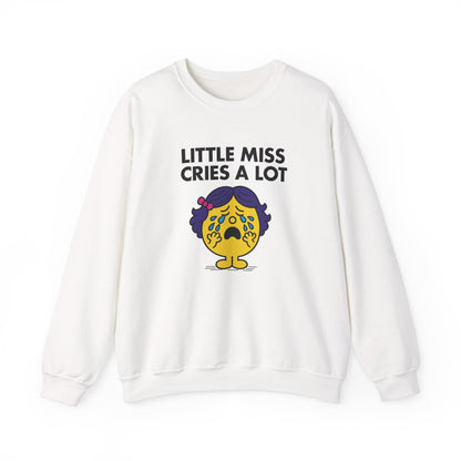 Front view of a white sweatshirt featuring the Little Miss Cries A Lot cartoon graphic. Part of the Little Miss Meme Character Collection. A Vivid Divergence Sensory Friendly Sweater Jumper.

