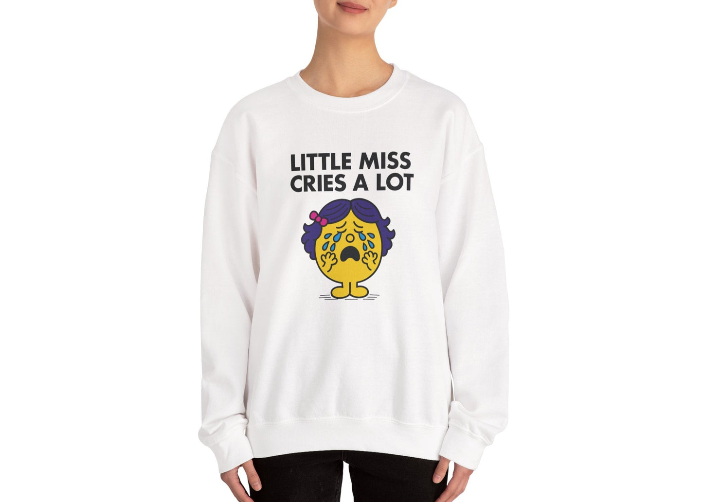 Person wearing the Little Miss Cries A Lot sweatshirt in a front-facing pose. Part of the Little Miss Meme Character Collection. A Vivid Divergence Sensory Friendly Sweater Jumper.
