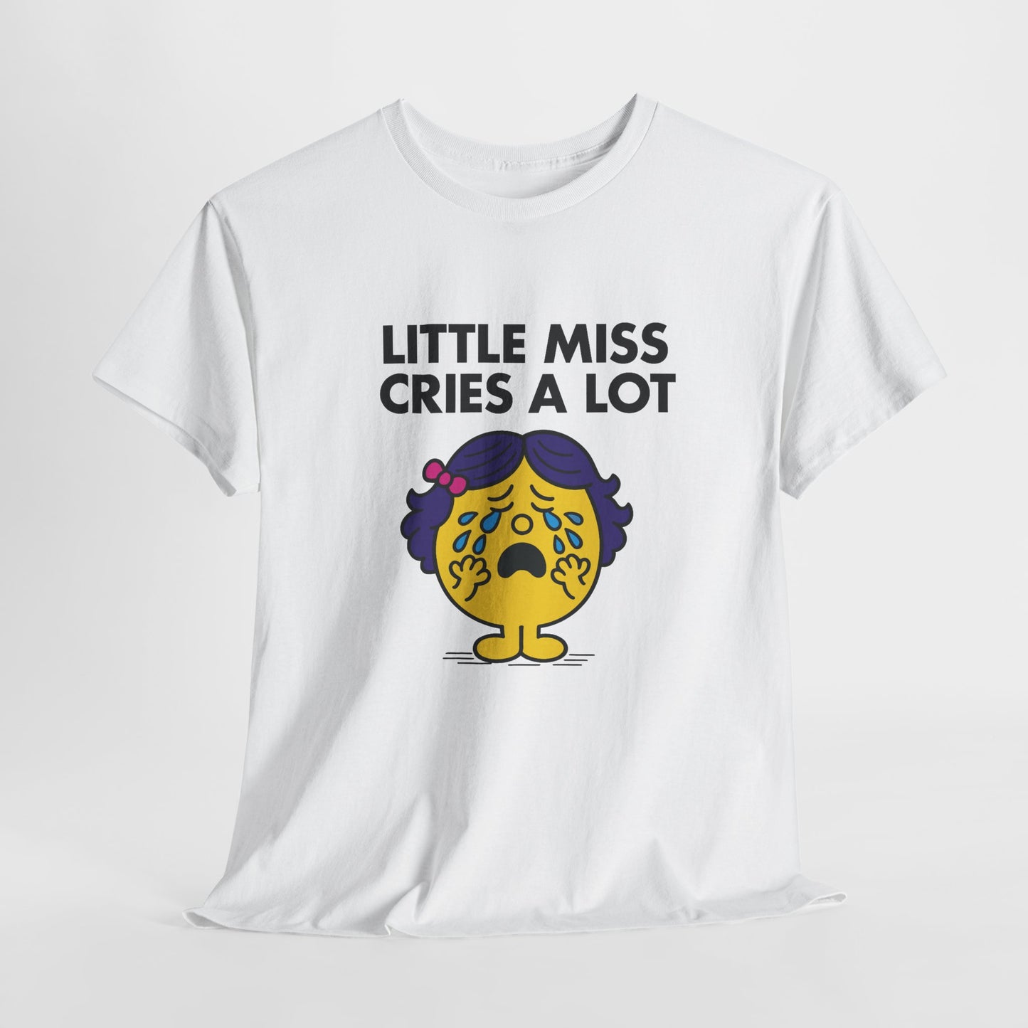 White Little Miss Cries A Lot T-shirt laid flat to show the full design. Part of the Little Miss Meme Character Collection. A Vivid Divergence Sensory Friendly Unisex Tee.
