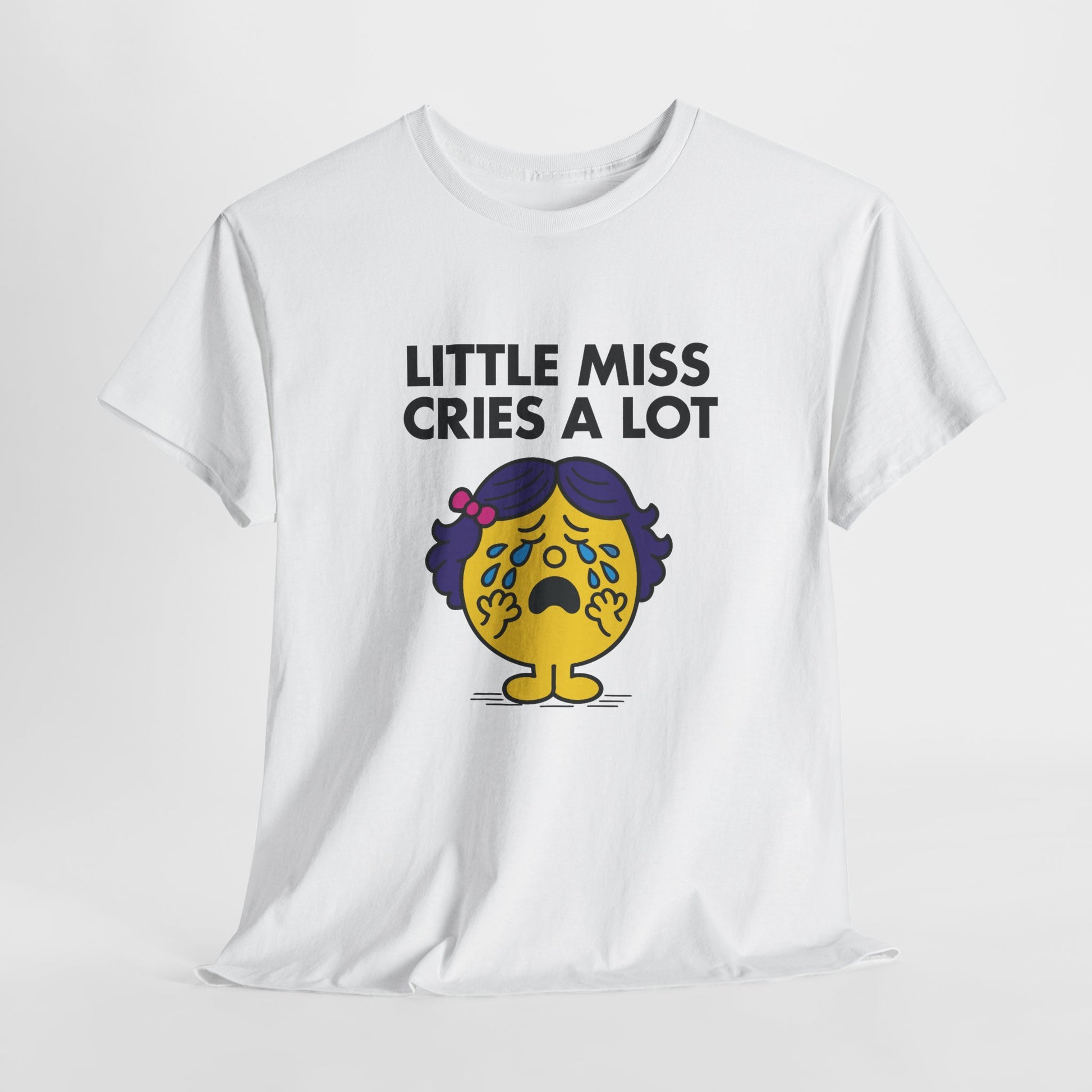 White Little Miss Cries A Lot T-shirt laid flat to show the full design. Part of the Little Miss Meme Character Collection. A Vivid Divergence Sensory Friendly Unisex Tee.
