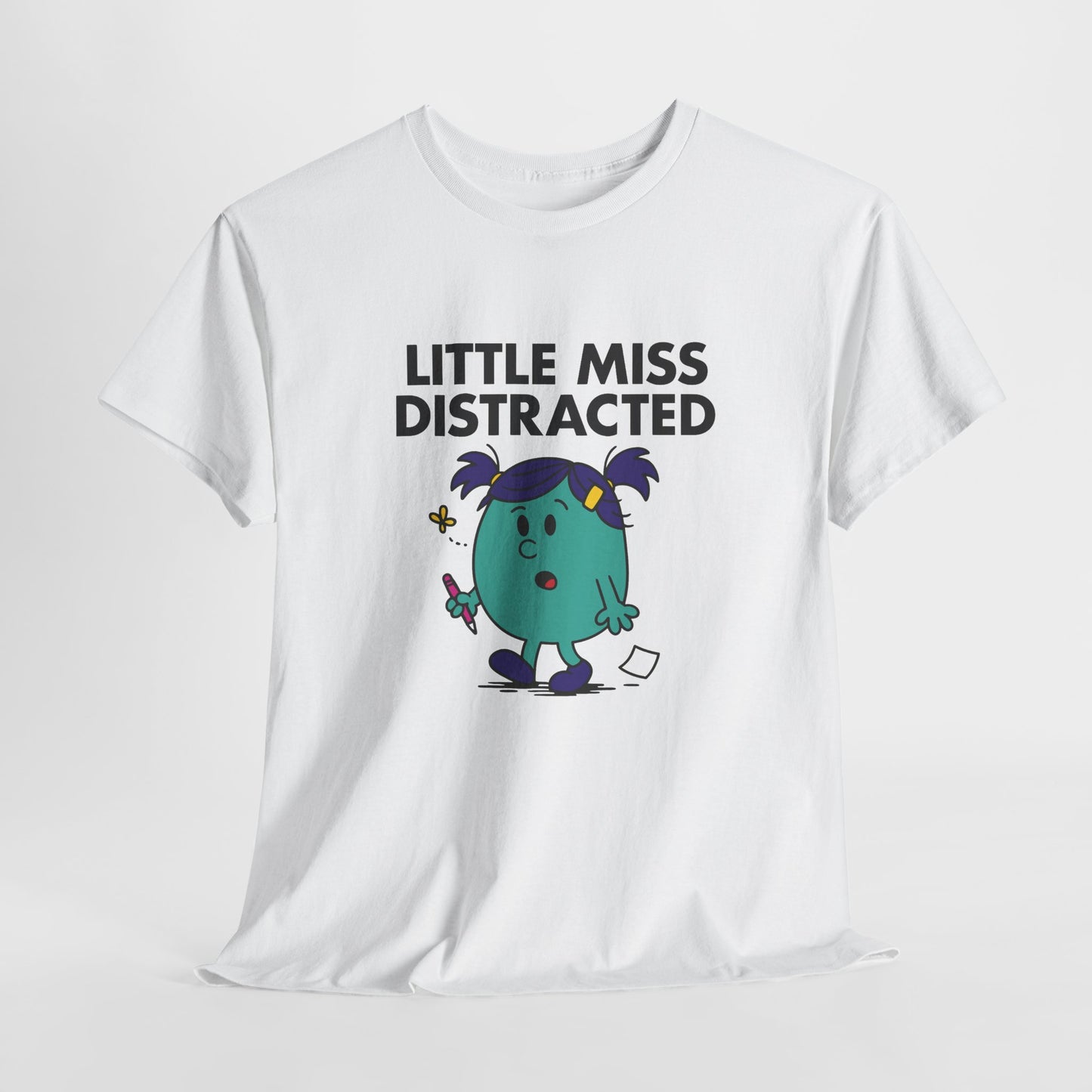 White Little Miss Distracted T-shirt laid flat to show full design. Part of the Little Miss Meme Character Collection. A Vivid Divergence Sensory Friendly Unisex Tee.
