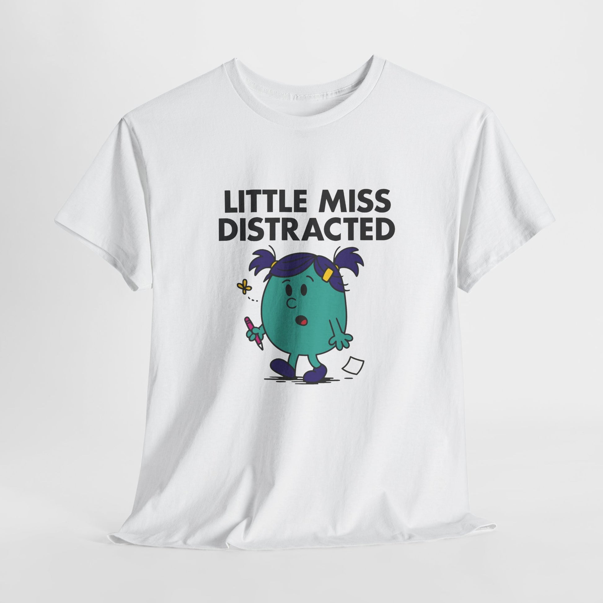 White Little Miss Distracted T-shirt laid flat to show full design. Part of the Little Miss Meme Character Collection. A Vivid Divergence Sensory Friendly Unisex Tee.

