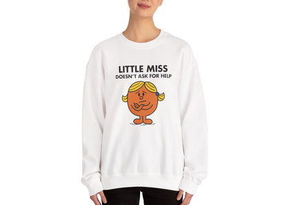 Person wearing the Little Miss Doesn’t Ask For Help sweatshirt in a relaxed pose. Part of the Little Miss Meme Character Collection. A Vivid Divergence Sensory Friendly Sweater Jumper.
