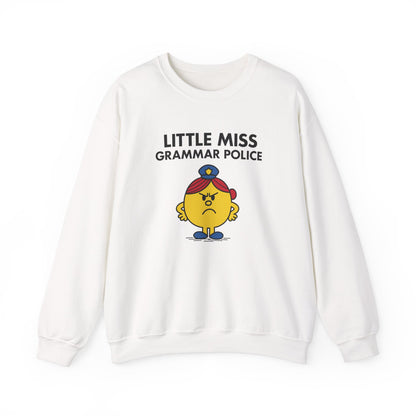 Front view of a white sweatshirt featuring the Little Miss Grammar Police cartoon graphic. Part of the Little Miss Meme Character Collection. A Vivid Divergence Sensory Friendly Sweater Jumper.
