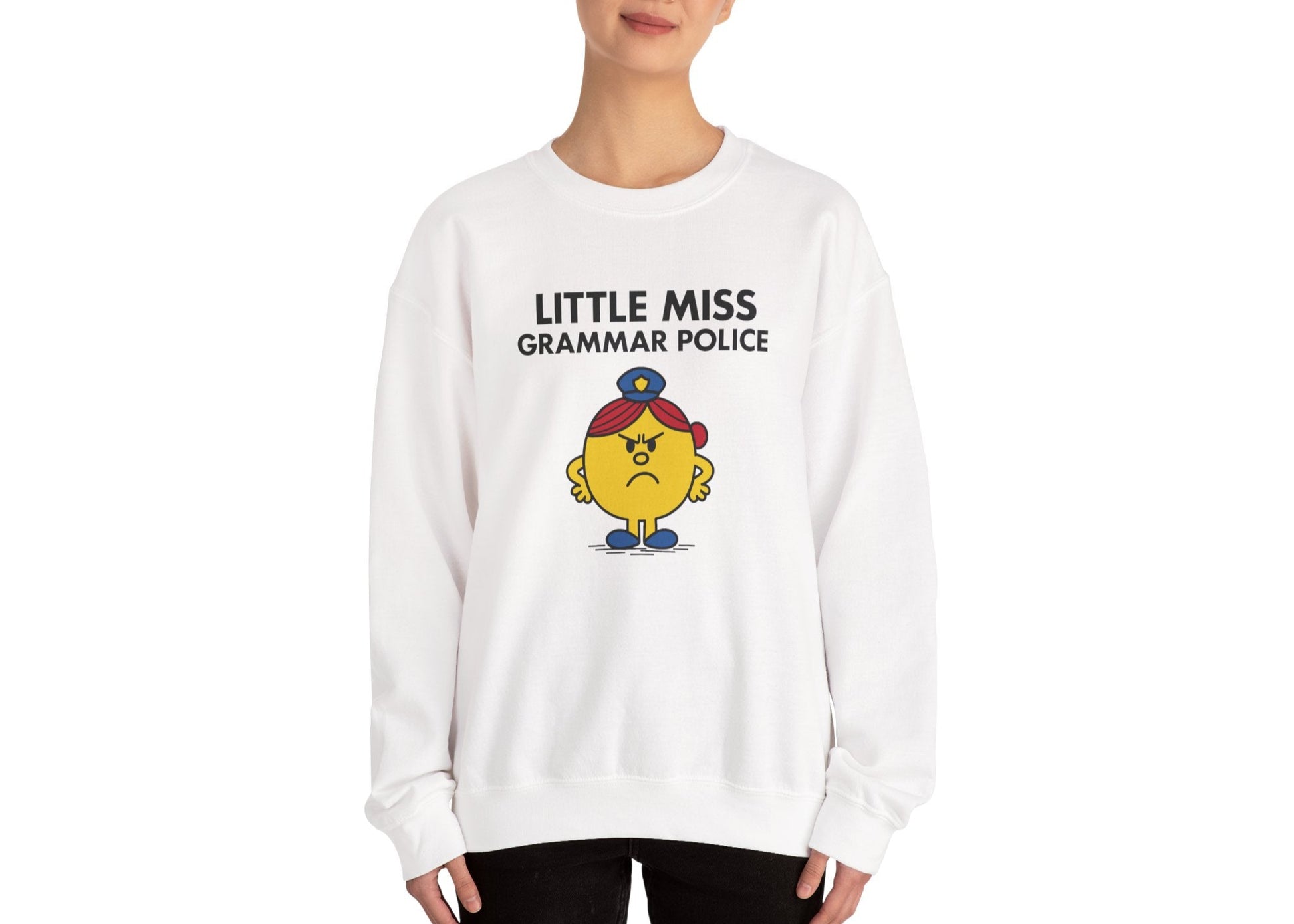 Person wearing the Little Miss Grammar Police sweatshirt in a standing pose. Part of the Little Miss Meme Character Collection. A Vivid Divergence Sensory Friendly Sweater Jumper.
