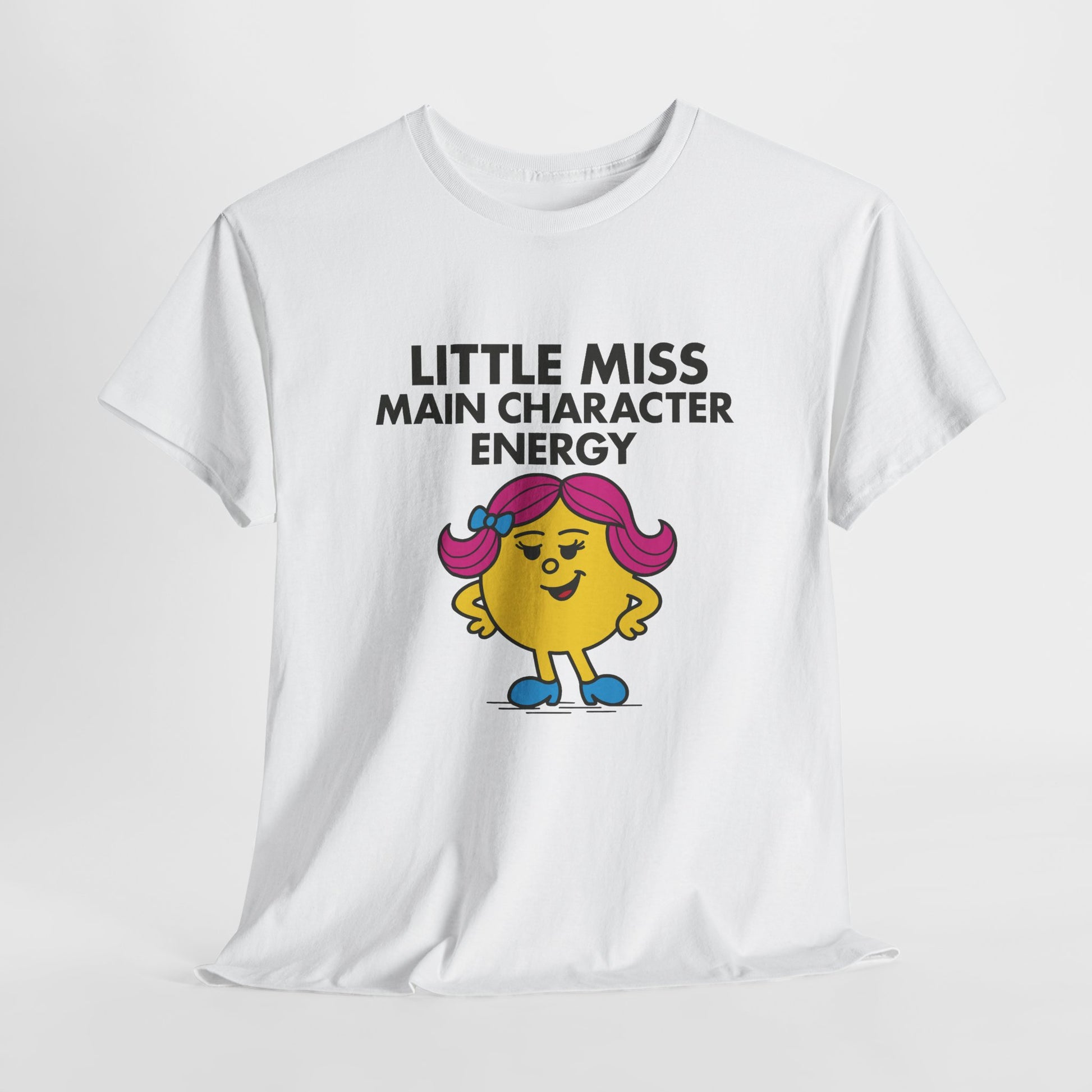 White Little Miss Main Character Energy T-shirt laid flat to display the full design. Part of the Little Miss Meme Character Collection. A Vivid Divergence Sensory Friendly Unisex Tee.
