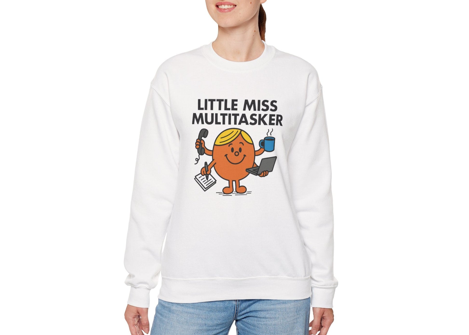 Person wearing the Little Miss Multitasker sweatshirt with blue jeans. Part of the Little Miss Meme Character Collection. A Vivid Divergence Sensory Friendly Sweater Jumper.
