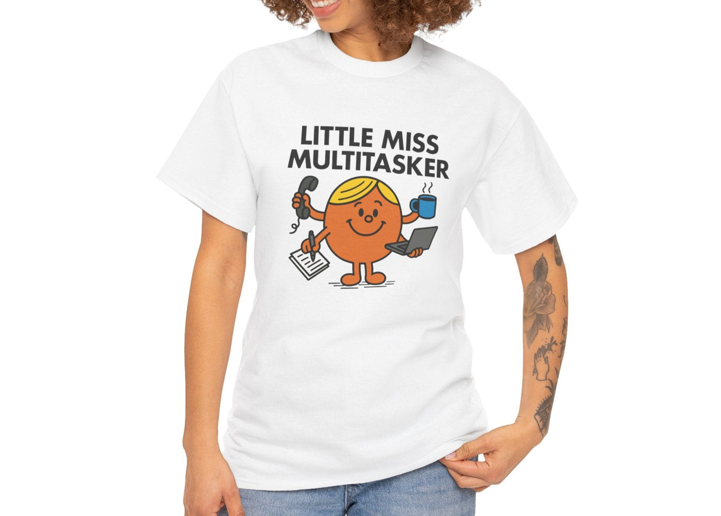 Person wearing the Little Miss Multitasker T-shirt styled with jeans. Part of the Little Miss Meme Character Collection. A Vivid Divergence Sensory Friendly Unisex Tee.
