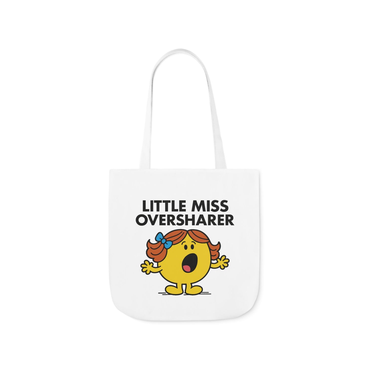 Front view of white canvas tote bag featuring yellow character with red pigtails, mouth open mid-story, and animated hands under the text "Little Miss Oversharer." You didn’t ask, but she told you anyway. Part of the Vivid Divergence Little Miss Meme Collection!
