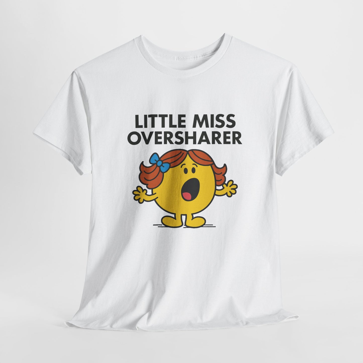 White Little Miss Oversharer T-shirt laid flat to show the full design. Part of the Little Miss Meme Character Collection. A Vivid Divergence Sensory Friendly Unisex Tee.
