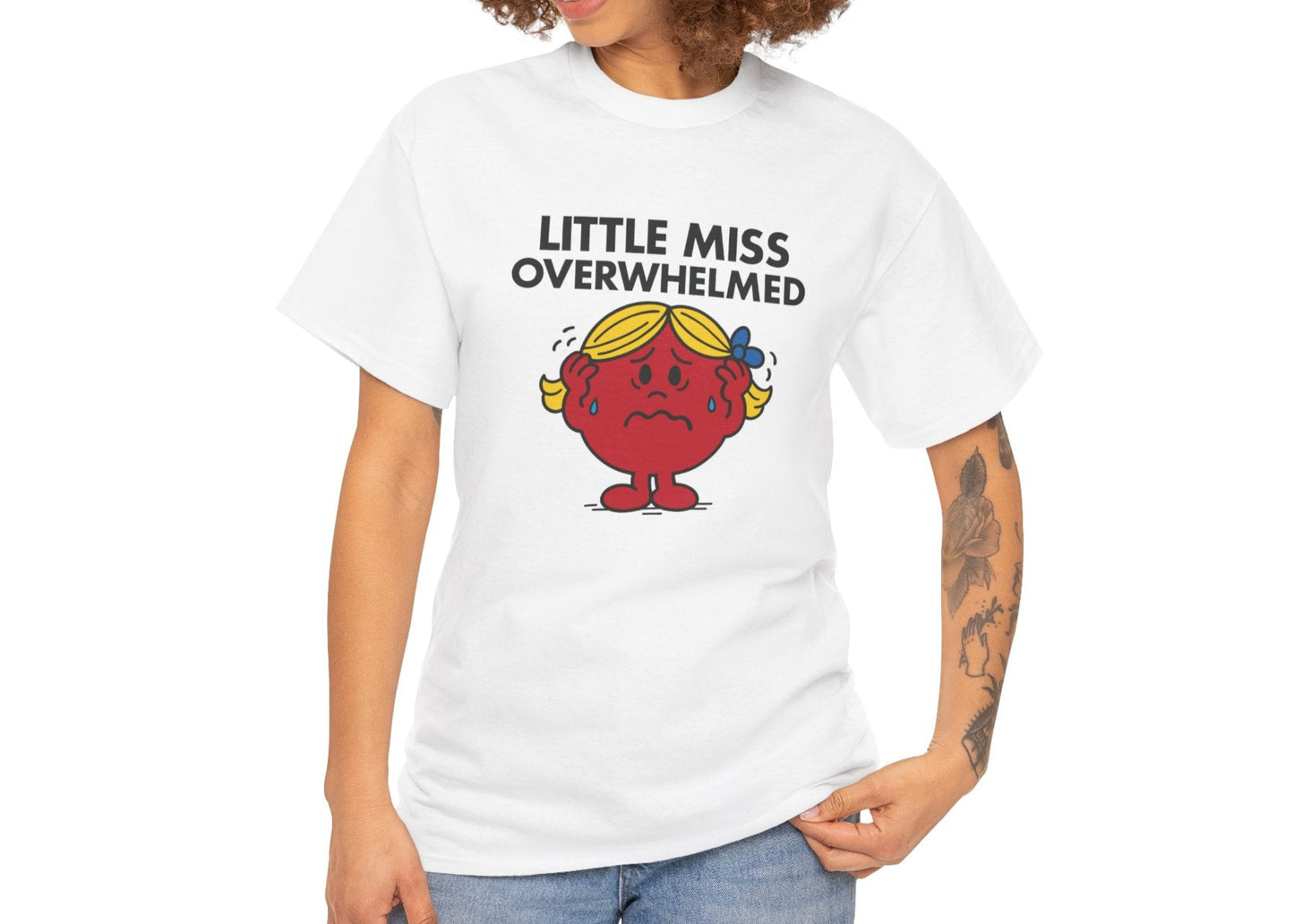 Person wearing the Little Miss Overwhelmed T-shirt with casual jeans. Part of the Little Miss Meme Character Collection. A Vivid Divergence Sensory Friendly Unisex Tee.
