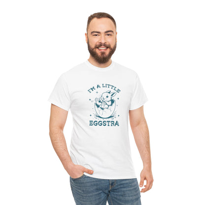 Man wearing a white Easter T-shirt featuring a playful bunny and "I'm A Little Eggstra" text, perfect for adding fun to Easter celebrations. Hop into the season in style and shop Easter shirts online today!
