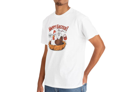 Man wearing a white Easter T-shirt featuring a comical "Happy Easter" scene of a surprised hen and a guilty bunny, ideal for a humorous holiday look. Hop into the season in style and shop Easter shirts online today!