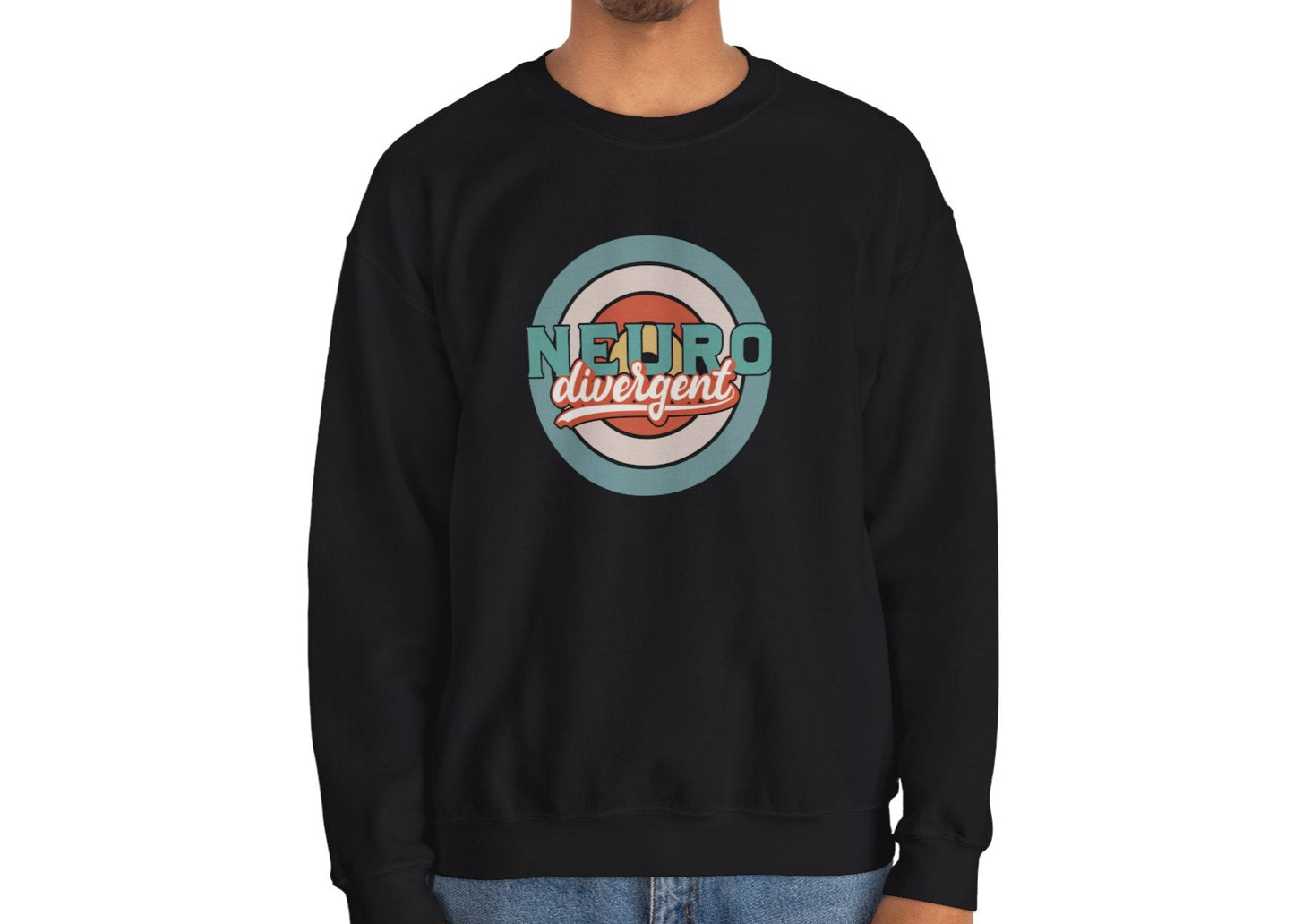 Model wearing a black sweatshirt with a retro-style circular target design and the word "Neurodivergent," standing with hands at sides. Part of the Vivid Divergence Sensory Friendly Unisex Sweater Jumper Range.