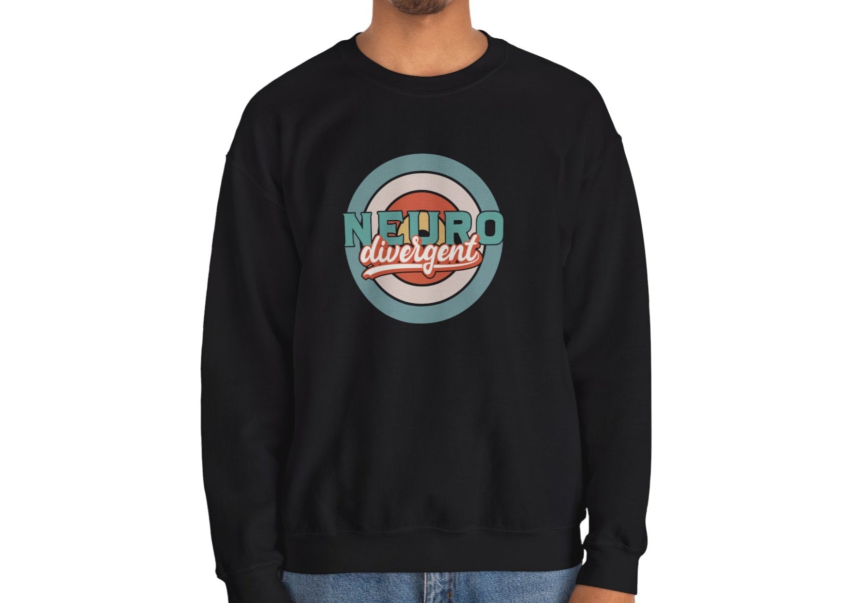 Model wearing a black sweatshirt with a retro-style circular target design and the word "Neurodivergent," standing with hands at sides. Part of the Vivid Divergence Sensory Friendly Unisex Sweater Jumper Range.