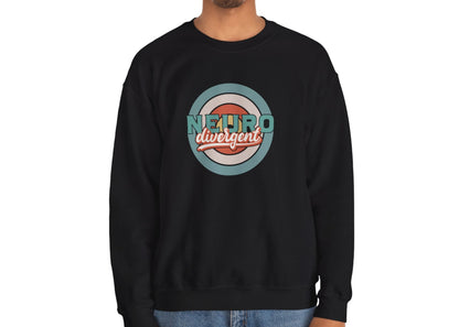 Model wearing a black sweatshirt with a retro-style circular target design and the word "Neurodivergent," standing with hands at sides. Part of the Vivid Divergence Sensory Friendly Unisex Sweater Jumper Range.