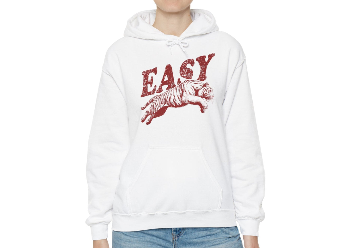  Model wearing a white hoodie with "EASY" in red letters and a leaping tiger graphic, standing with hands at sides. Part of the Vivid Divergence Sensory Friendly Unisex Hoodie Range.