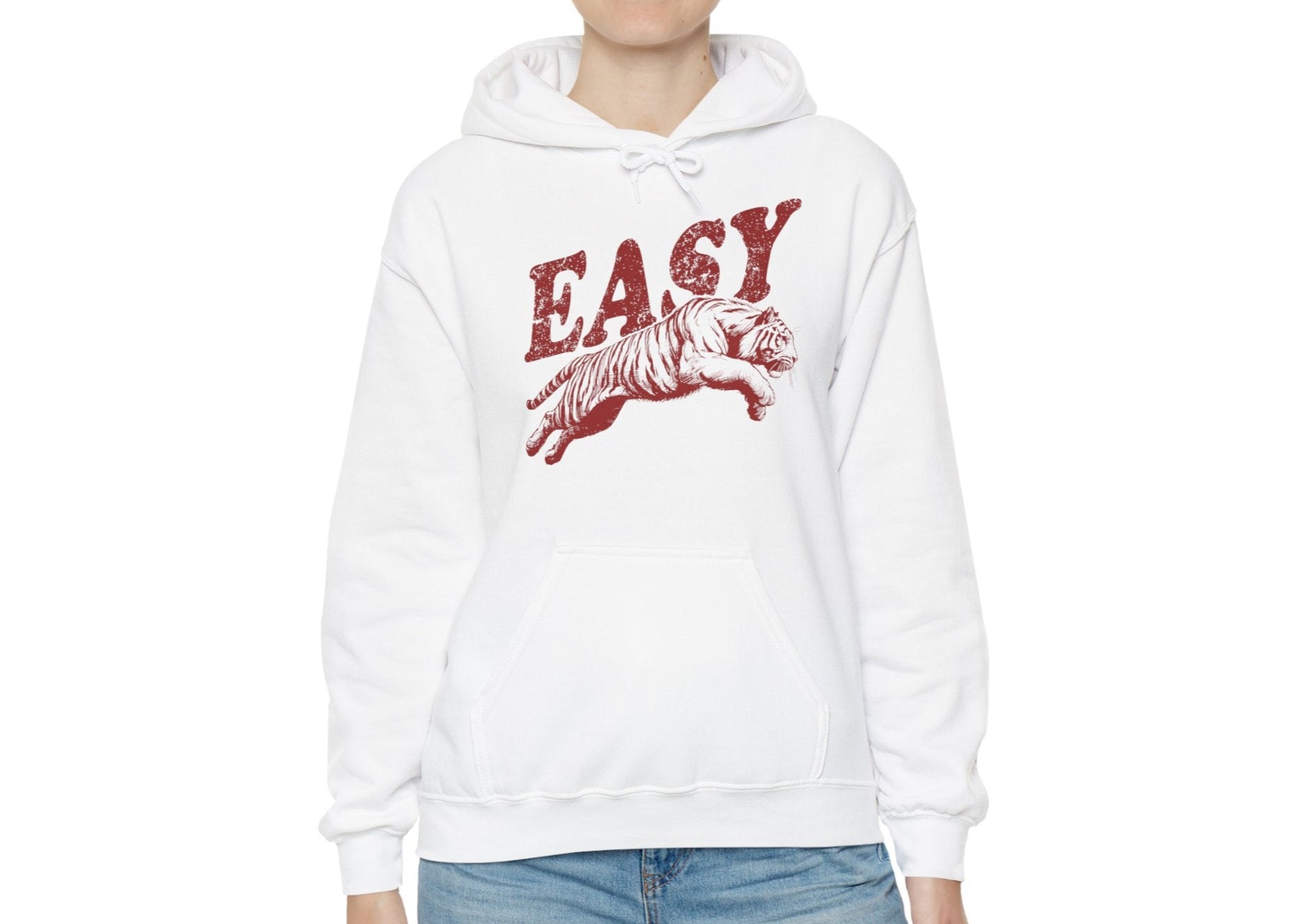  Model wearing a white hoodie with "EASY" in red letters and a leaping tiger graphic, standing with hands at sides. Part of the Vivid Divergence Sensory Friendly Unisex Hoodie Range.