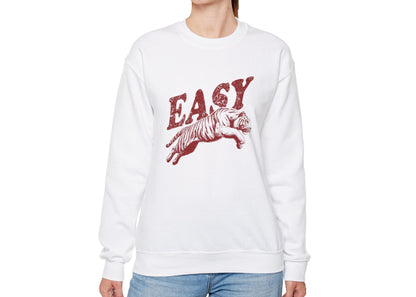 Model wearing a white sweatshirt with "EASY" in red letters and a leaping tiger graphic, standing with hands at sides. Part of the Vivid Divergence Sensory Friendly Unisex Sweater Jumper Range.